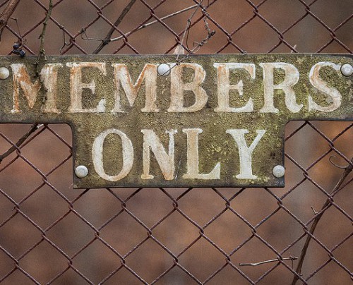 Members only sign on fence