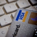 Photo of credit card laying on a keyboard