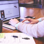 managing brand reputation online, woman working at computer