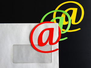 email marketing, letter with email sybmol in postage location, challenges with email marketing